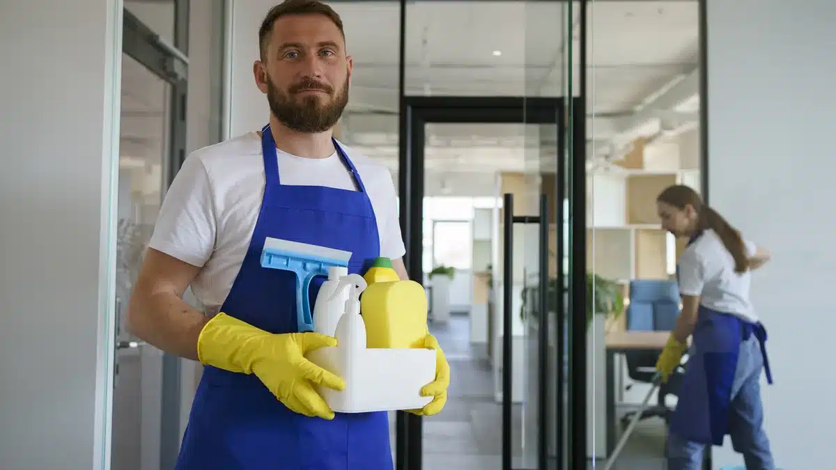 Cleaning professional holding supplies for a building maintenance round